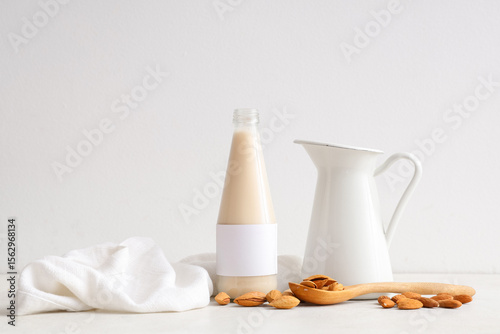 Bottle and jug of fresh alm...