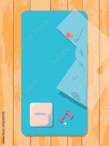aerial shot of yoga mat with neatly placed yoga block, towel, and small dumbbells on a wooden floor, minimalist composition