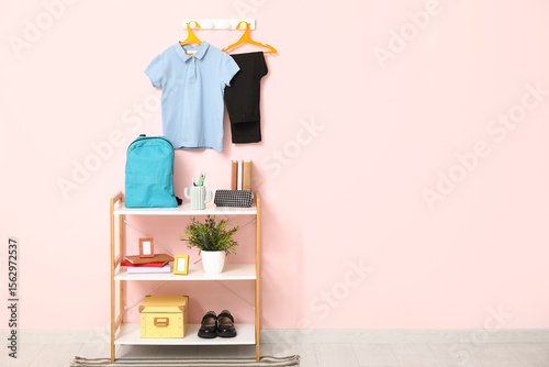 Rack with stationery, decor...