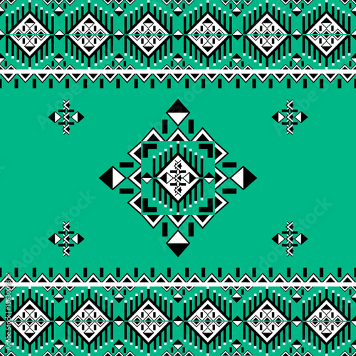 Geometric ethnic boho seamless pattern on a green background. Native ethnic pattern. Tribal pattern. Aztec ornament. Ideas for wallpaper, carpet, fabric vector, tiles, elaborate borders, and textiles.
