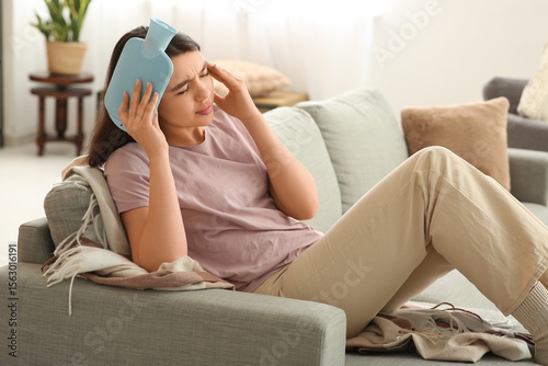 Young woman warming her hea...
