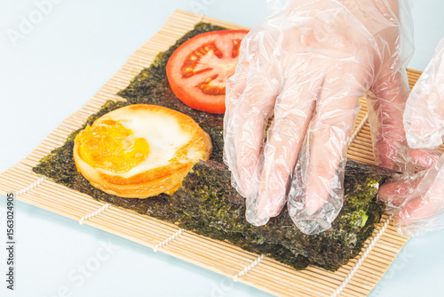 Close up of the process of making delicious sushi