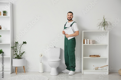 Male plumber with clipboard...