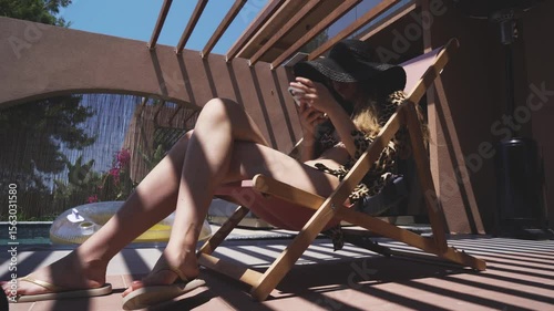 Woman Relaxing at Greek Villa with Coffee and Smartphone Peaceful Morning in Halkidiki