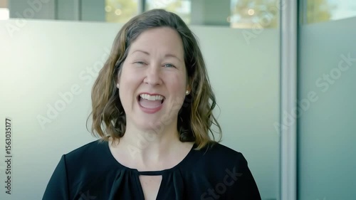 Confident Woman Explaining Business Strategy in Modern Office