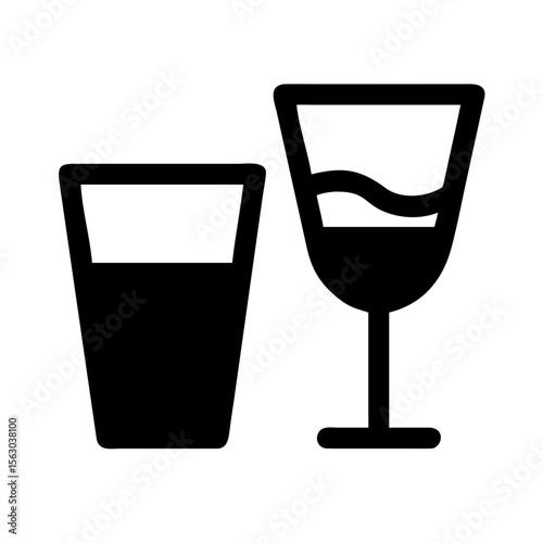 Two different drinking glasses, one filled with liquid, showcasing beverage variety.