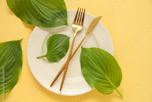 White ceramic plate with go...