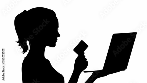 Silhouette of woman holding credit card and using laptop for online shopping transaction process view