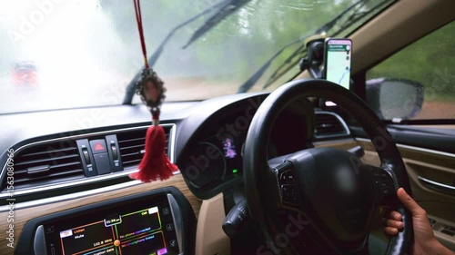 Car Driving in Rainy Weather with Navigation