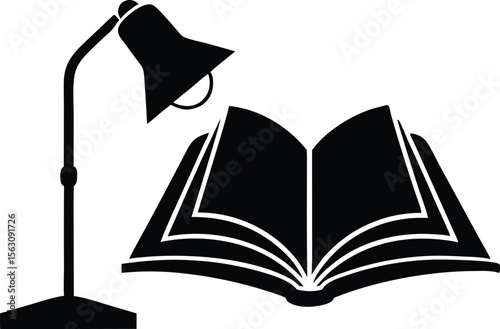 open book illuminated by a desk lamp reading study