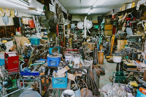 A cluttered workshop in Montreal, Quebec, Canada, filled with tools, equipment, and various objects. A creative space, showcasing the tools and materials used for artistic endeavors.