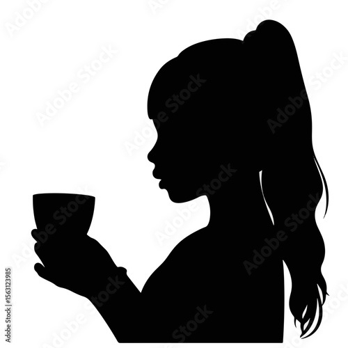 Girl blowing on hot chocolate drink silhouette, cozy warmth
