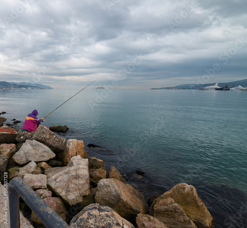 Fishing in the gulf of la spezia at sunset