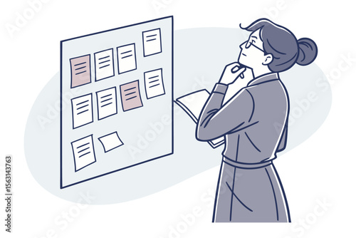 A thoughtful woman in glasses examines a bulletin board with various notes and highlighted papers contemplating her next steps