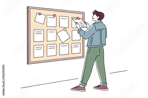 Young man in casual attire thoughtfully reviewing notes pinned to a bulletin board in a minimalist office setting