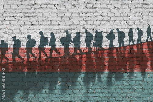 The refugees migrate to Europe union . Silhouette of illegal immigrants . Europe union migration policy. Flag of Belarus painted on a brick wall. High quality