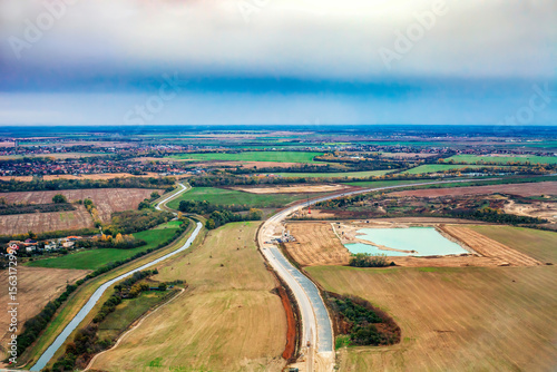 Road under construction in autumn fields near Bratislava in Slovakia, top view