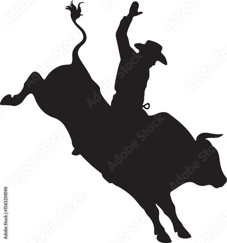 Silhouette of cowboy riding bucking bull rodeo