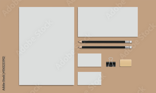 3d letterhead, envelope, pencils and blank business cards on brown background.