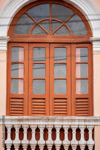 Vintage Arched Window with Balcony Railing