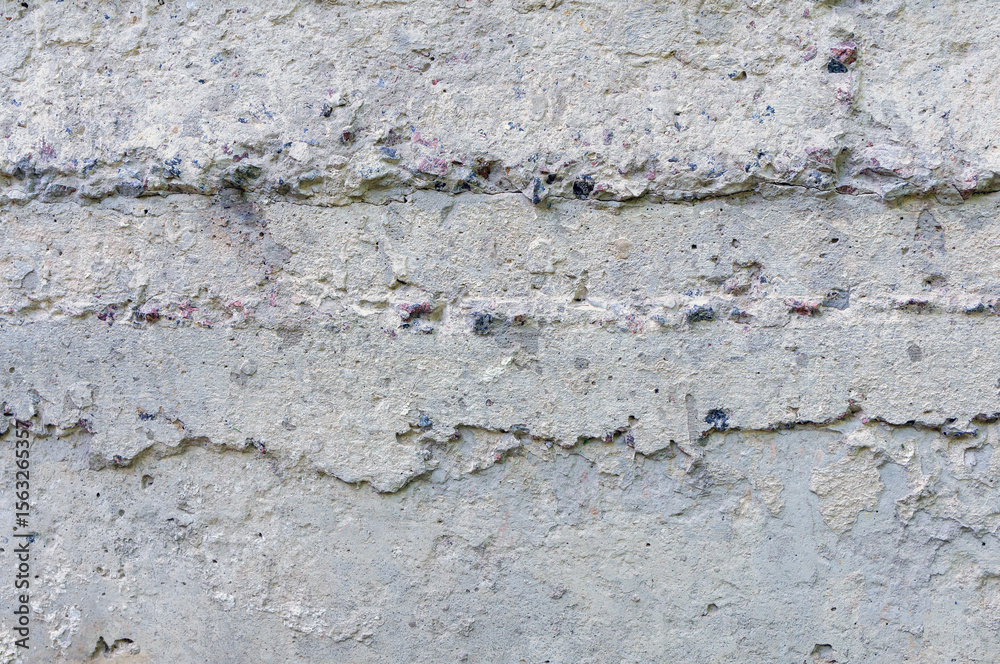 Obraz premium Concrete wall showing signs of aging and weathering