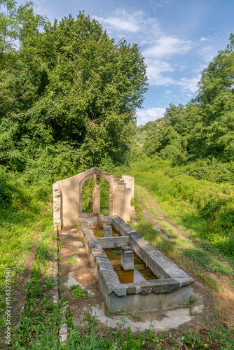 The 19th century Castagni fountain, old wash houses where housewives washed baskets of clothes, Fauglia, Pisa, Italy