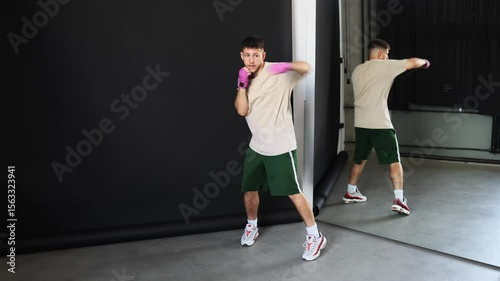 Athlete practices boxing technique in a modern training space during midday hours