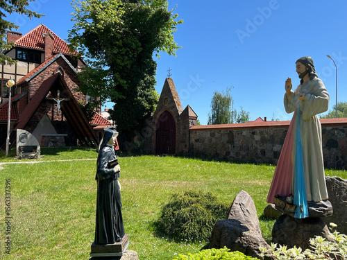 Figure of Merciful Jesus and Saint Sister Faustina in the garden of the Sanctuary of Divine Mercy in Mysliborz in the West Pomeranian Voivodeship in Poland