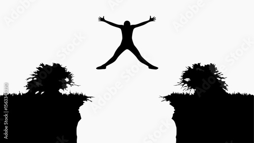 Silhouette of a person jumping between two cliffs with arms outstretched in a black and white landscape