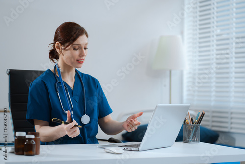 Caring therapist conducts video consultation, communicates with patient via an online conference, uses laptop, diagnoses, recommended and prescribed medications, and also answers questions.