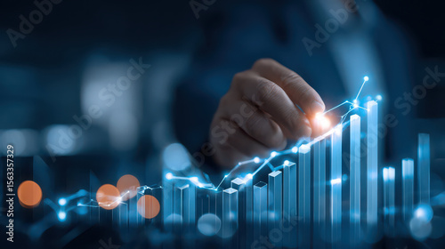 Businessman analyzing financial growth data with glowing graph