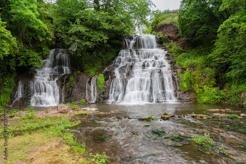 Cascade waterfall on Dzhuryn river in spring overcast day, Ukraine