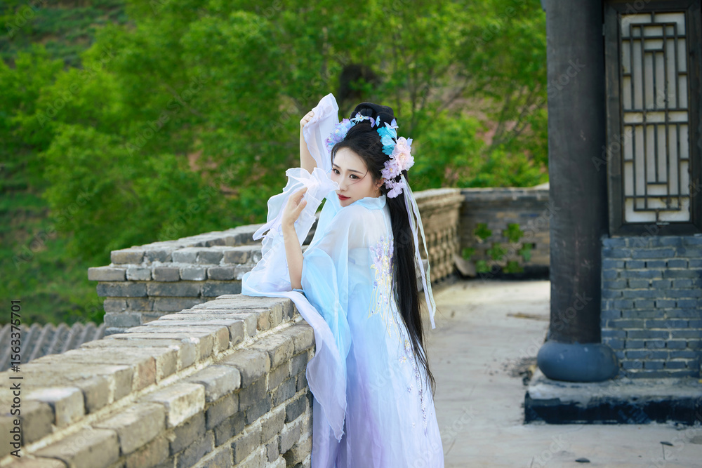 Oriental beauty wearing Hanfu taking photos in the ancient city Oriental beauty wearing Hanfu taking photos in the ancient city