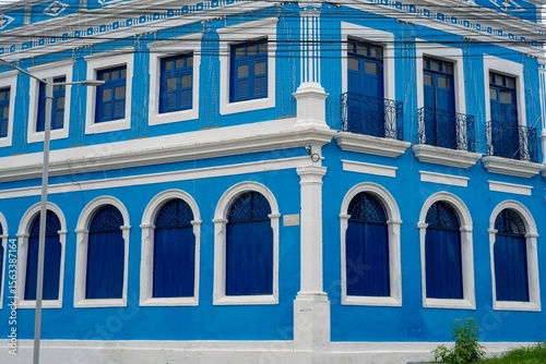 Vibrant blue colonial building facade.