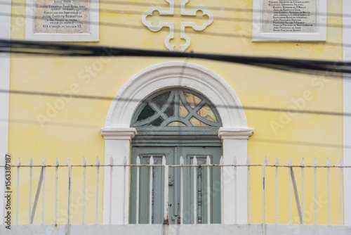 Vibrant yellow wall with arched window