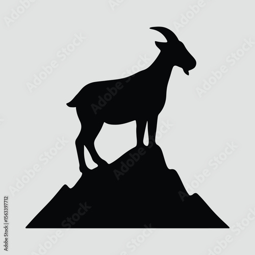 Silhouette of a goat standing on mountain top vector illustration