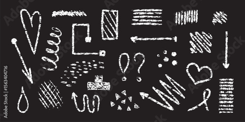 White crayondrawn arrows hearts shapes and punctuation against black background