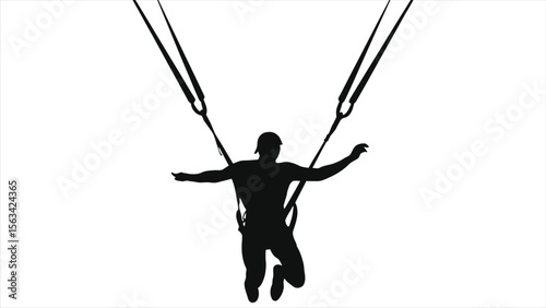 A silhouetted man is bungee jumping with arms outstretched against a light sky, capturing the thrill of extreme sport