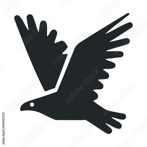 Black silhouette of a flying bird with outstretched wings