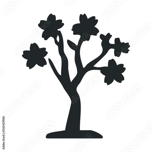 Silhouette of flowering tree with blossoms on branches
