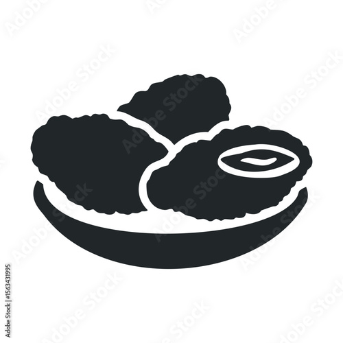 Silhouette of crunchy fried chicken pieces in a bowl