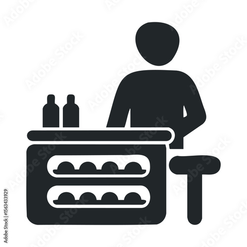 Silhouette of bartender at counter with bottles and bar stool