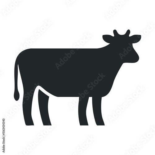 Silhouette of a standing cow with tail in profile view