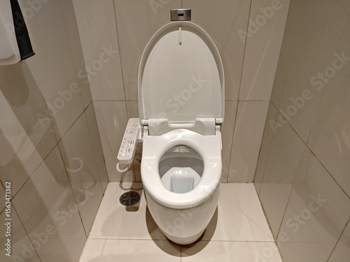 Modern Bathroom with Clean White Toilet and Sleek Tile Flooring