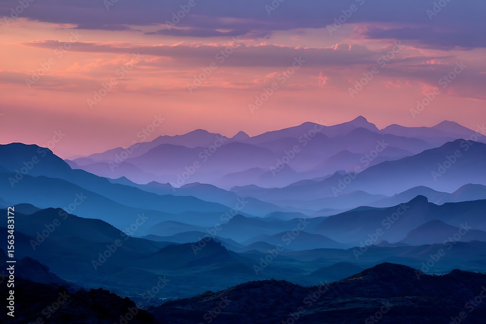 Fototapeta premium Sunset ridge silhouette with blue and purple mountain layers 