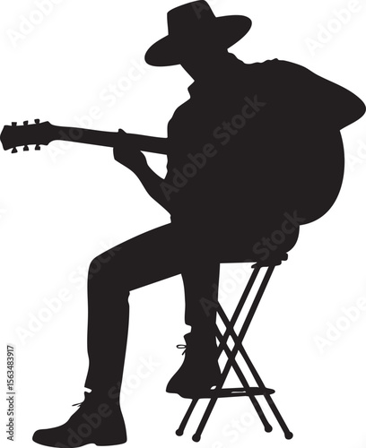 Silhouette of a Musician Playing Acoustic Guitar