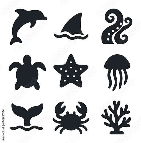 Marine Life Icons. Solid, filled icons set of marine creatures: jumping dolphin, shark fin, octopus arms, sea