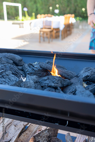 Outdoor barbecue grill with burning charcoal flames
