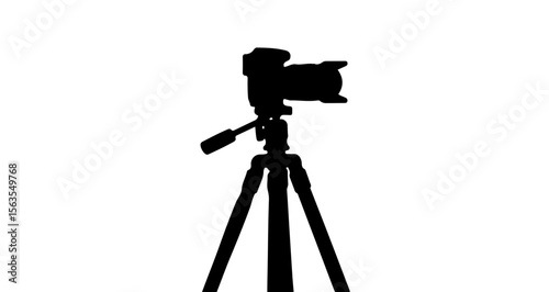 Silhouette of a camera mounted on a tripod against a white background in a studio setting photography