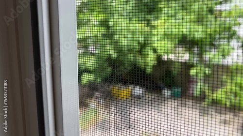Fly screen mosquito net attached to window frame for insect protection